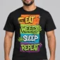 Eat Weed Sleep Repeat on a model wearing a black graphic T-shirt with C63s.com hem branding